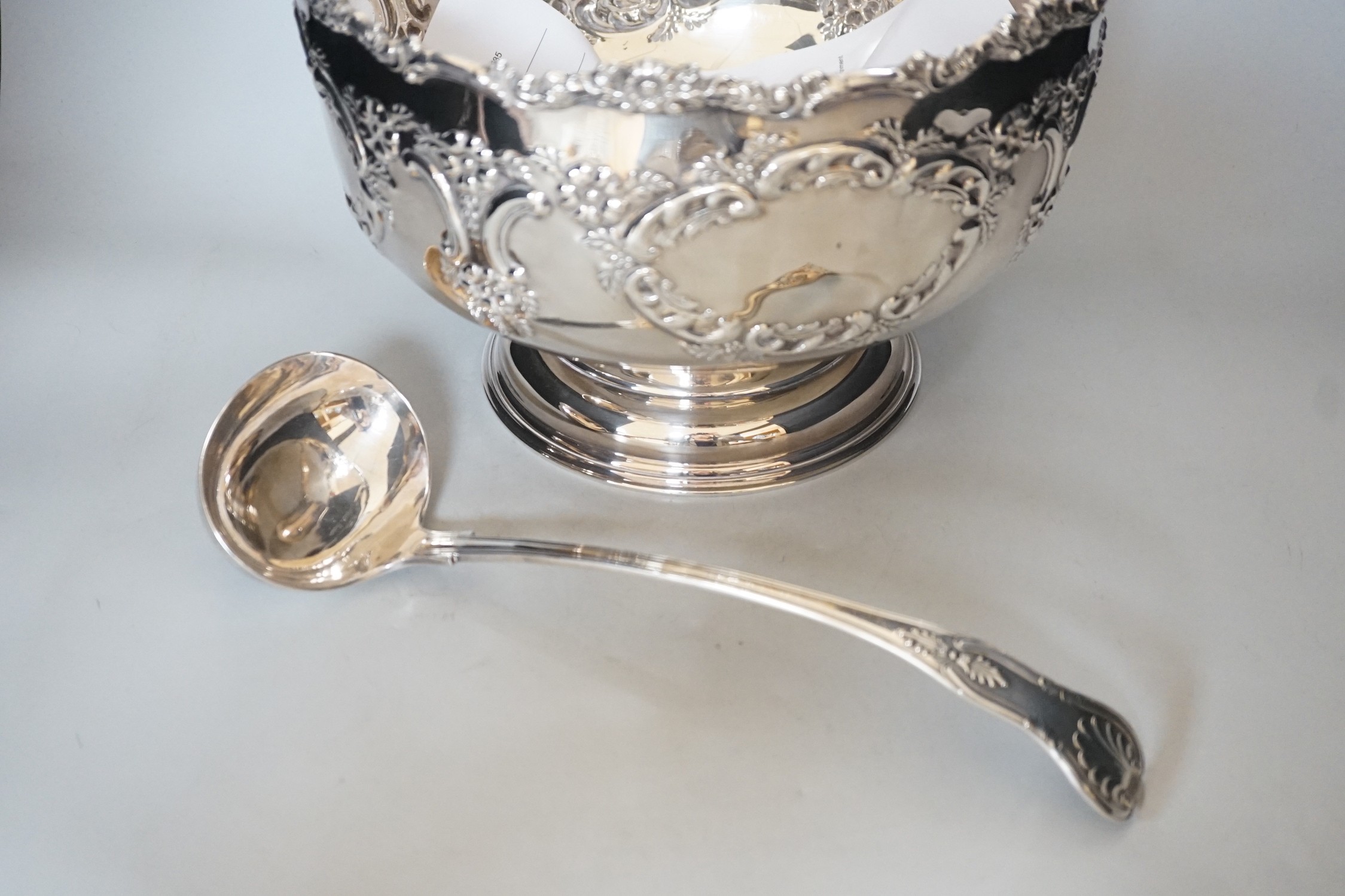 A Sheffield plated punch bowl and a plated soup ladle, bowl 30cms diameter